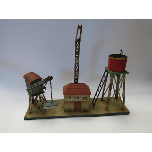 5293 - A Kibri 0 gauge model railway tinplate goods depot with water tower, crane and building mounted on b... 