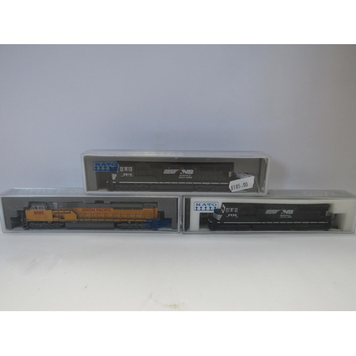 5302 - Three Perspex cased Kato N gauge model railway locomotives to include 176-8608-1 Kobo with TCS DCC i... 