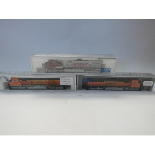 5306 - Three Perspex cased Kato N gauge model railway locomotives in BNSF livery to include 176-6321-DCC EM... 