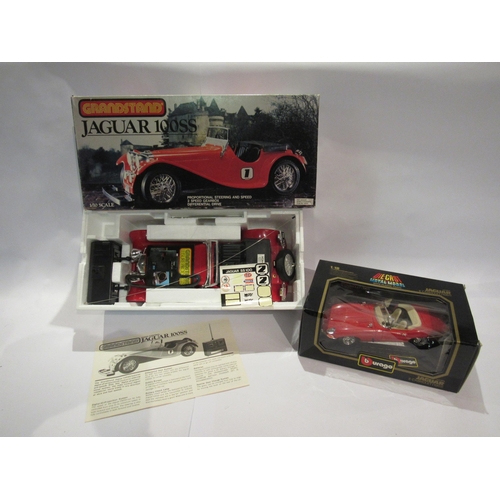 5190 - A boxed Grandstand 1:10 scale radio control Jaguar 100SS and a Burago 1:18 scale diecast Jaguar E Ca... 