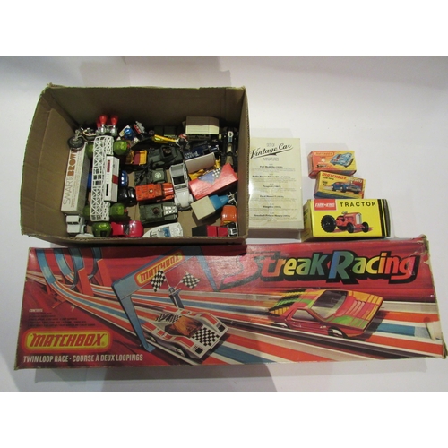 5198 - A boxed Matchbox Streak Racing race course together with assorted boxed and loose diecast vehicles i... 