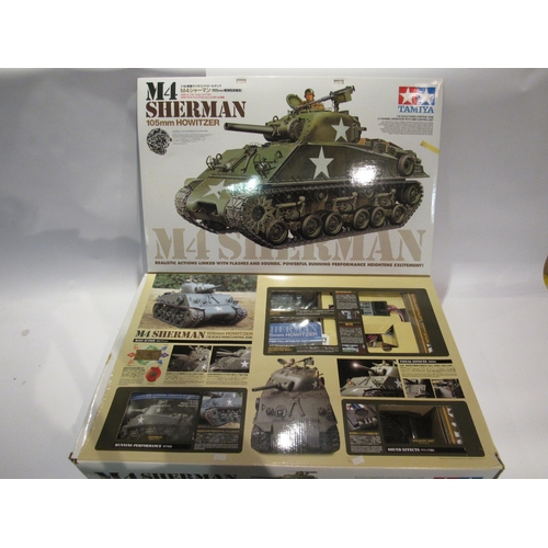 5209 - A boxed Tamiya 1:16 scale radio controlled 105mm Howitzer M4 Sherman Tank full-option kit, item 5601... 