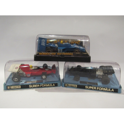 5215 - Three Perspex cased Scalextric slot racing cars to include C050 JPS Formula 1, C026 March Ford 721 a... 