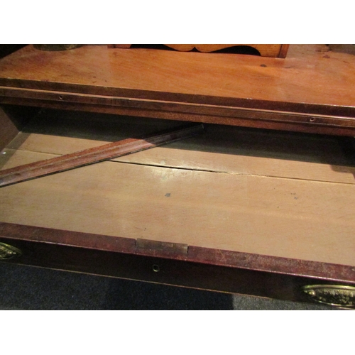 1064 - A George III mahogany straight front chest of four long graduated drawers with brushing slide.  Feet... 