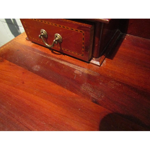 1067 - An Edwardian mahogany dressing table, two short over two long drawers, 152cm high x 107cm wide x 49c... 