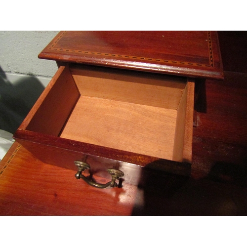 1067 - An Edwardian mahogany dressing table, two short over two long drawers, 152cm high x 107cm wide x 49c... 