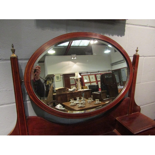 1067 - An Edwardian mahogany dressing table, two short over two long drawers, 152cm high x 107cm wide x 49c... 