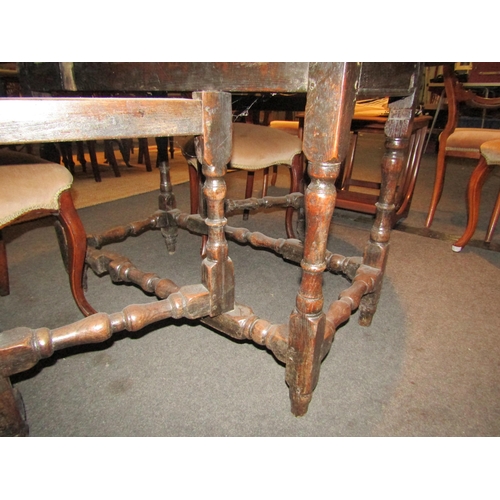 1079 - A late 18th Century oak drop-leaf dining table with oval top   (E)  £20-30