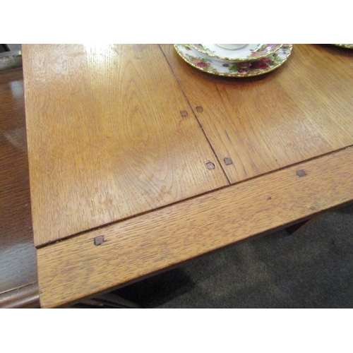 1082 - A light oak kitchen table, square tapering legs, 76cm high x 107cm long x 70cm wide (E)  £20-30