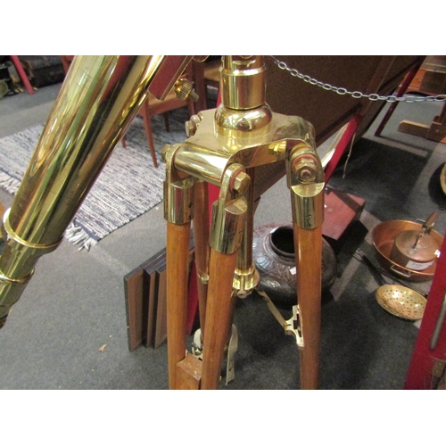 1134 - A modern brass telescope on tripod stand