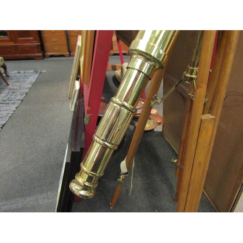 1134 - A modern brass telescope on tripod stand