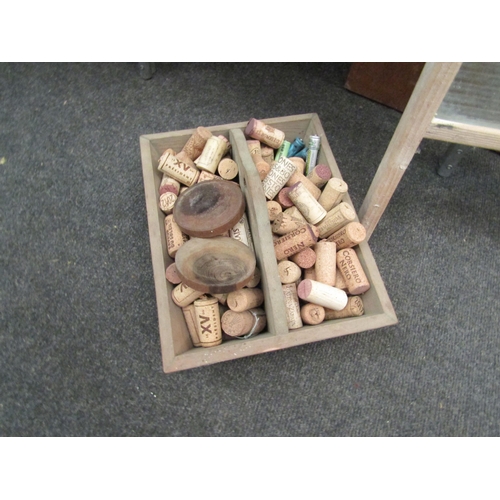 1155 - A vintage washboard and cutlery box with cork contents