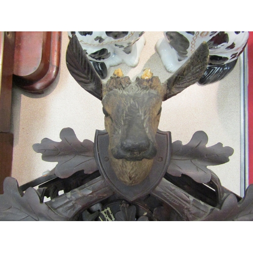 1158 - A Black Forest cuckoo clock with deer and game detail, A/F