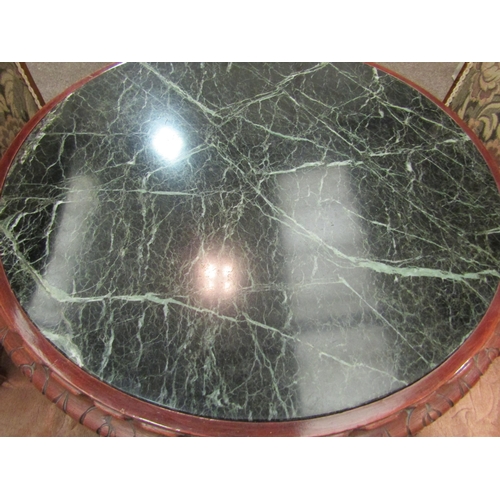 1181 - A modern circular carved coffee table with dark marble effect insert