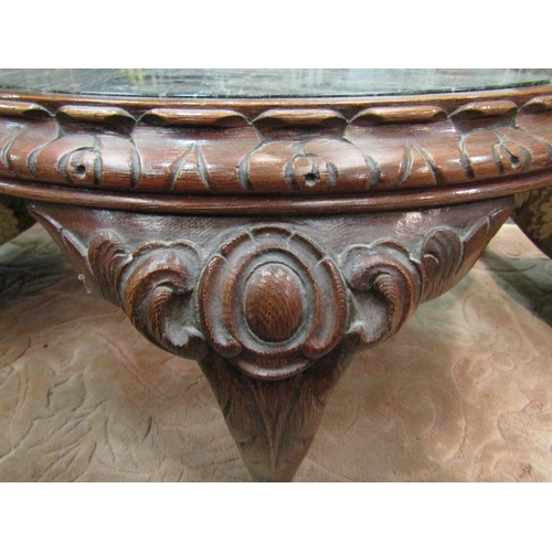 1181 - A modern circular carved coffee table with dark marble effect insert