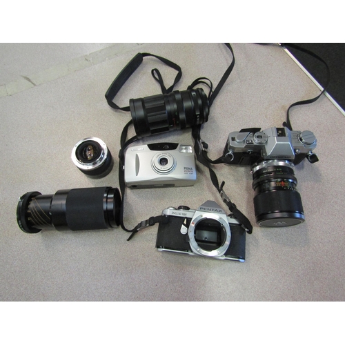 1182 - A good quantity of assorted cameras and accessories including case containing Olympus OM30 camera wi... 