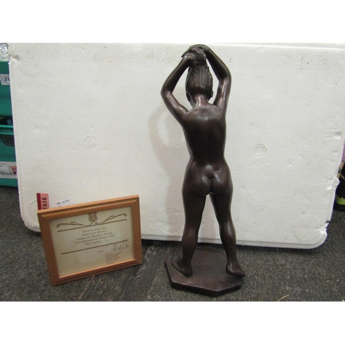 1203 - A limited edition bronzed figure of a female nude, 