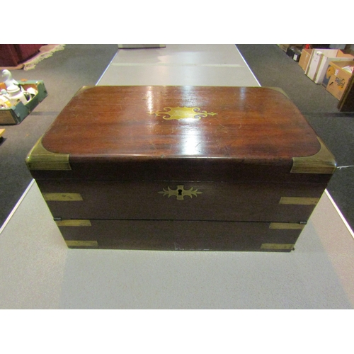 1324 - A mahogany and brass banded stationery box with letter slots, inkwell and tooled leather interior