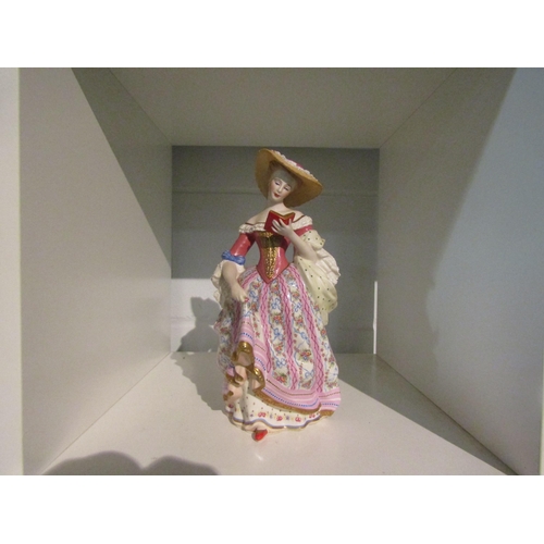 1402 - A V & A Museum No. A4163 porcelain reproduction figure of a lady reading a book, 25cm high    (E)  £... 