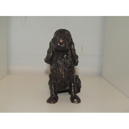 1428 - A cast metal figure of a spaniel, 14.5cm high