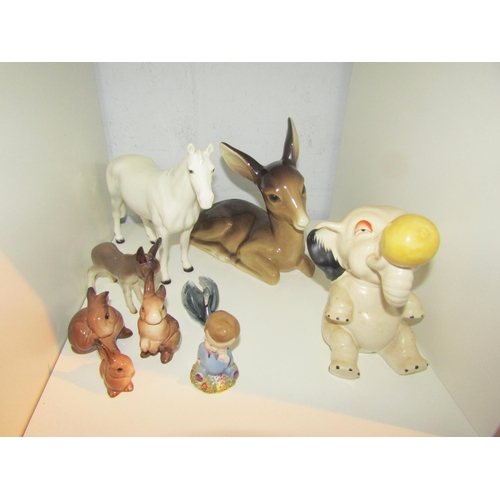 1441 - A collection of animal figures including Beswick white horse and and fox a/f