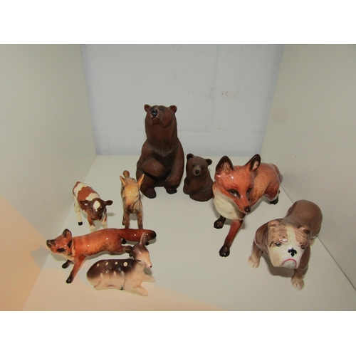 1441 - A collection of animal figures including Beswick white horse and and fox a/f