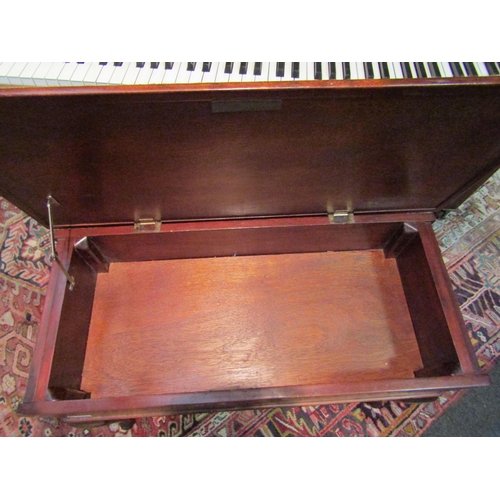 1007A - A mahogany piano stool on cabriole legs