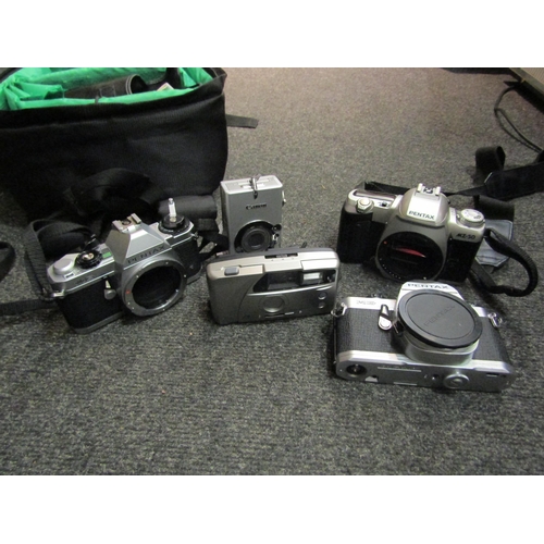 1524 - Three boxes containing a good quantity of assorted cameras and camera accessories including Pentax, ... 