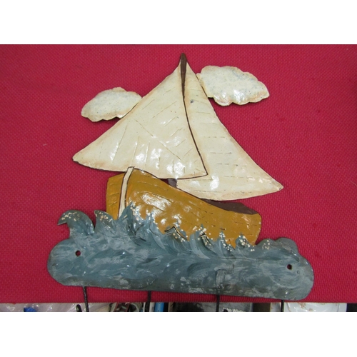 1549 - A metal coat hook as a sail boat