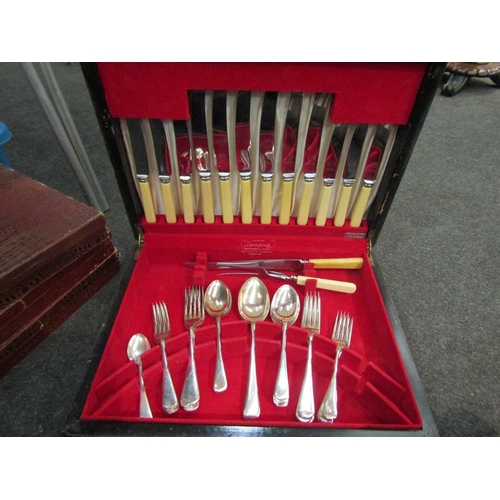 1562 - A box of metal wares and cased cutlery, including Persian kettle