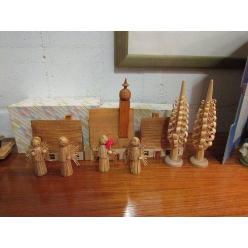 1144 - A selection of Christmas decorations to include a boxed poly-resin nativity set, A Christmas Carol s... 