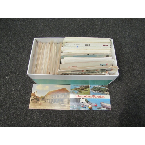 1390 - A box of postcards and stamps