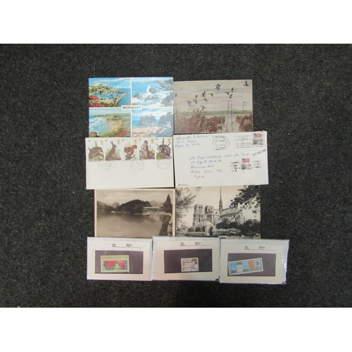 1390 - A box of postcards and stamps