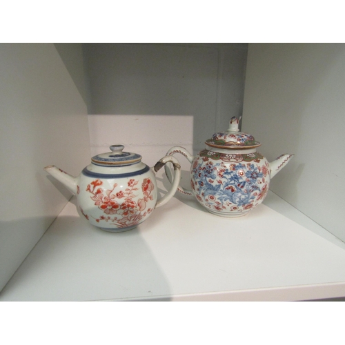 1403 - Two 18th Century Chinese porcelain teapots of small proportions (a/f and one lid mis-matched)    (E)... 