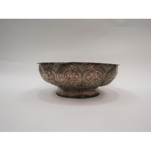 1423 - A 19th Century Tibetan silver bowl with floral panels, 9cm high x 22cm diameter