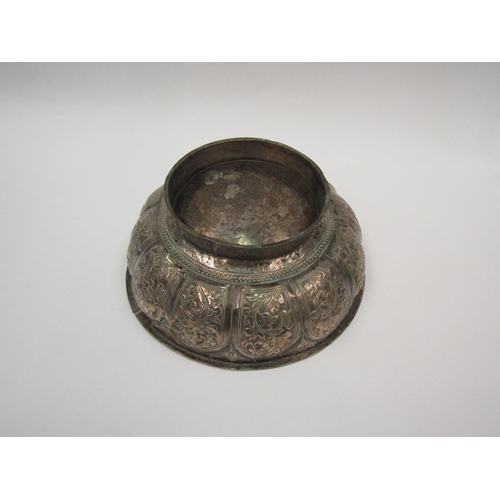 1423 - A 19th Century Tibetan silver bowl with floral panels, 9cm high x 22cm diameter