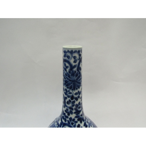 1542 - A 19th Century Chinese bottle vase with all-over floral detailing, 39cm high