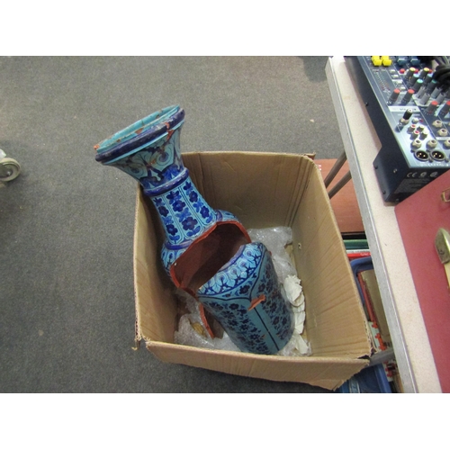 1563 - A Persian terracotta blue glazed vase with floral design, very badly damaged    (E)  £10-20