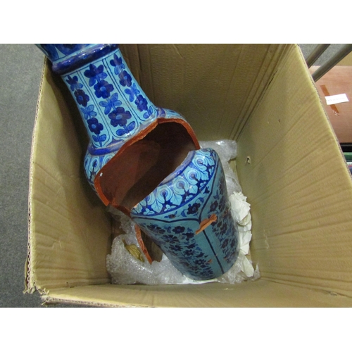 1563 - A Persian terracotta blue glazed vase with floral design, very badly damaged    (E)  £10-20