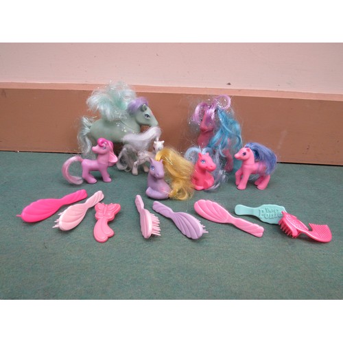 5063A - A collection of My Little Pony and similar figures together with a quantity of brushes and combs