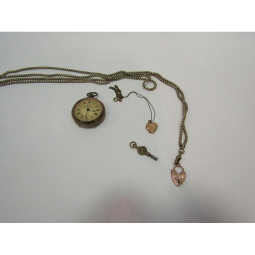 1340 - A pocket watch with cracked face and two lockets marked 375 with chains