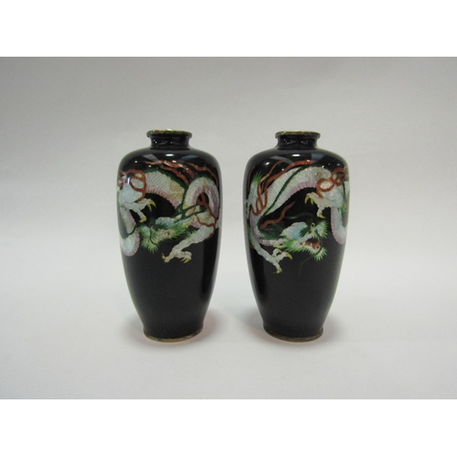 1342 - A pair of Japanese enamelled vases depicting three toed dragons, 12cm high