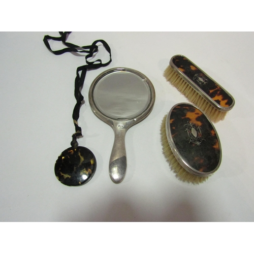 1379 - Two silver and tortoiseshell brushes and hand mirror together with a tortoiseshell effect cased smal... 