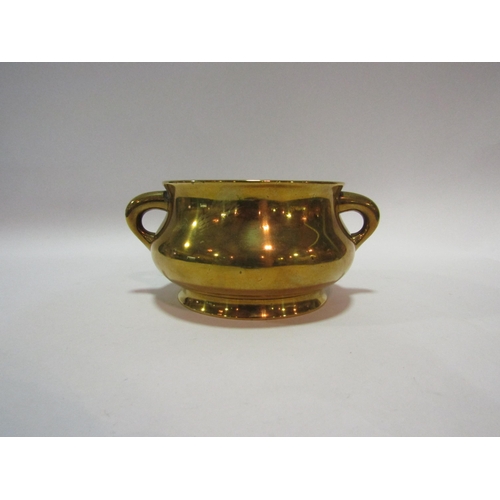 1384 - An Eastern brass or bronze twin handled censer with character mark to base, 15cm diameter