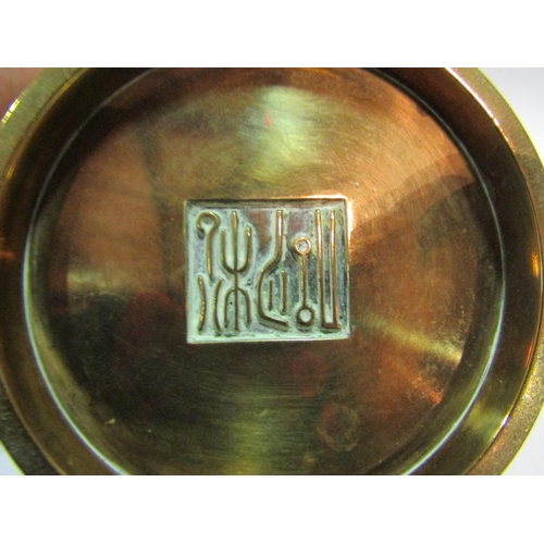 1384 - An Eastern brass or bronze twin handled censer with character mark to base, 15cm diameter