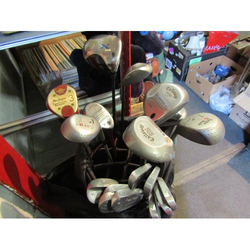 1231 - Three golf bags with clubs