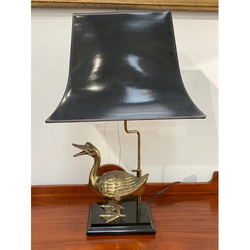 4010 - A modern brass duck figural lamp with black shade, 73cm tall