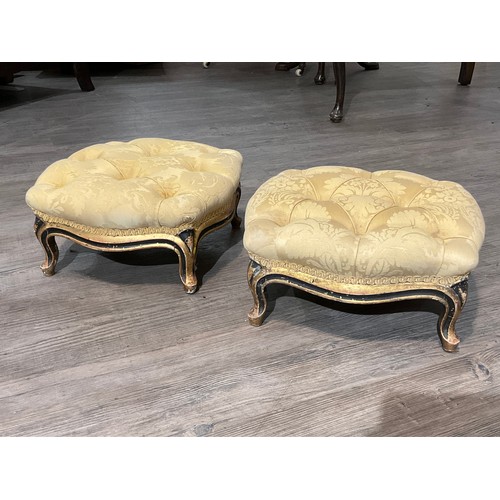 4025 - A pair of Nosotti foot stools, button foliate upholstery on gilt and ebonised cabriole feet, oval pl... 