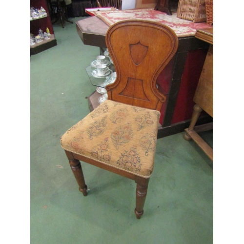 4026 - In the manner of Gillows of Lancaster, a pair of mid-Victorian oak hall chairs, the spoon shape back... 