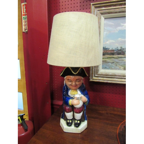 4040 - A Staffordshire Toby Jug style table lamp with cream shade, 40cm tall with shade   (R)  £10